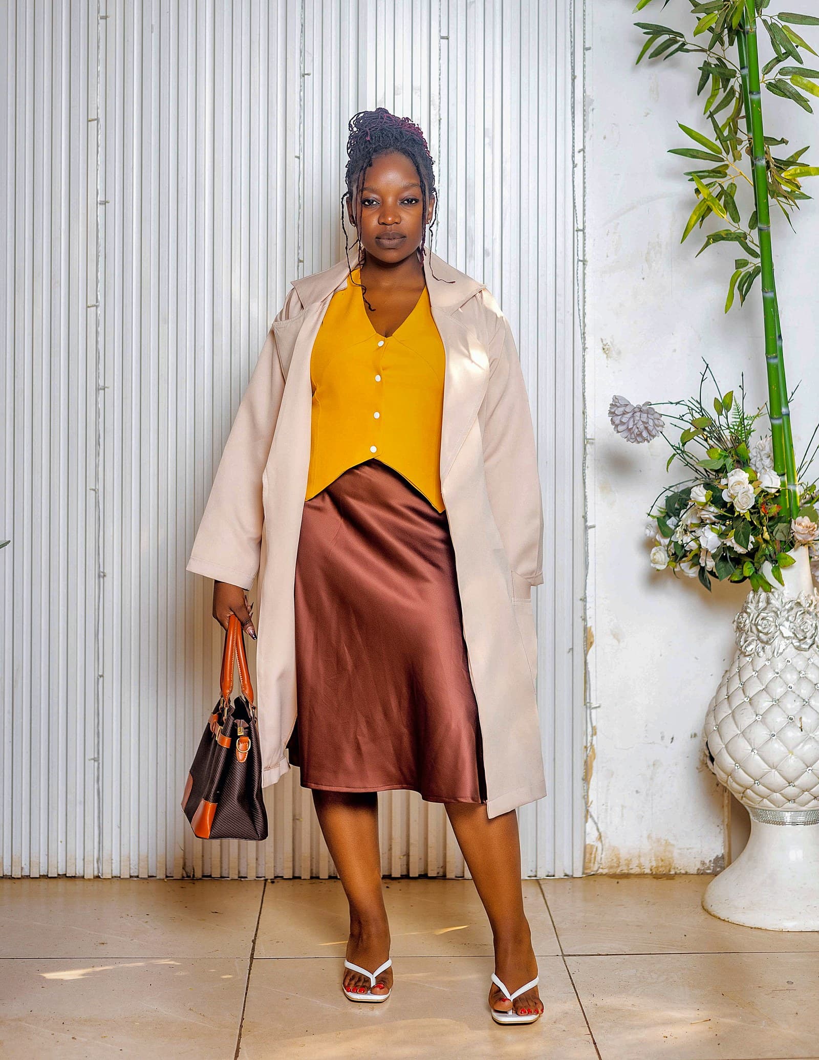Cream coat, mustard waistcoat and bronze satin skirt