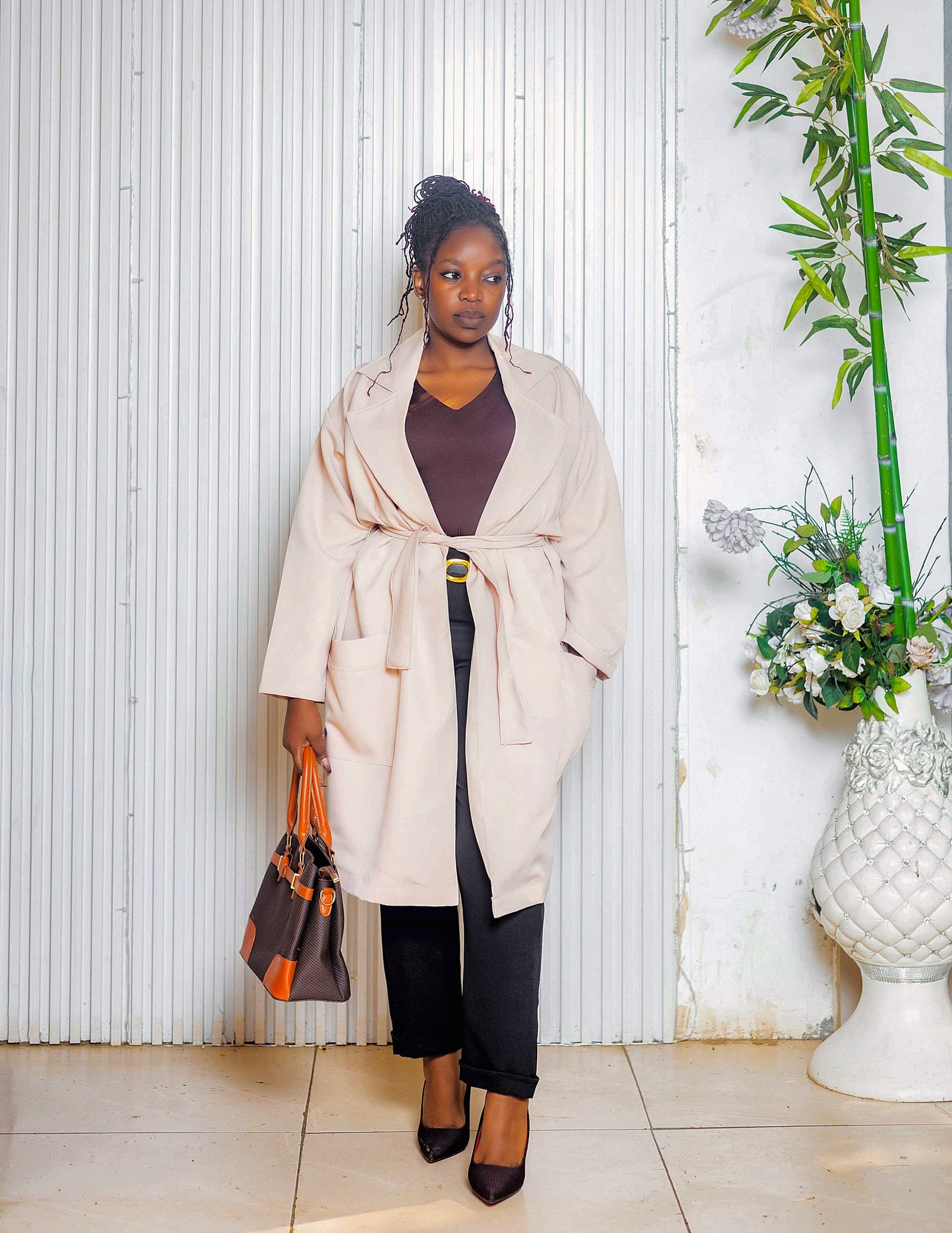Cream coat over black