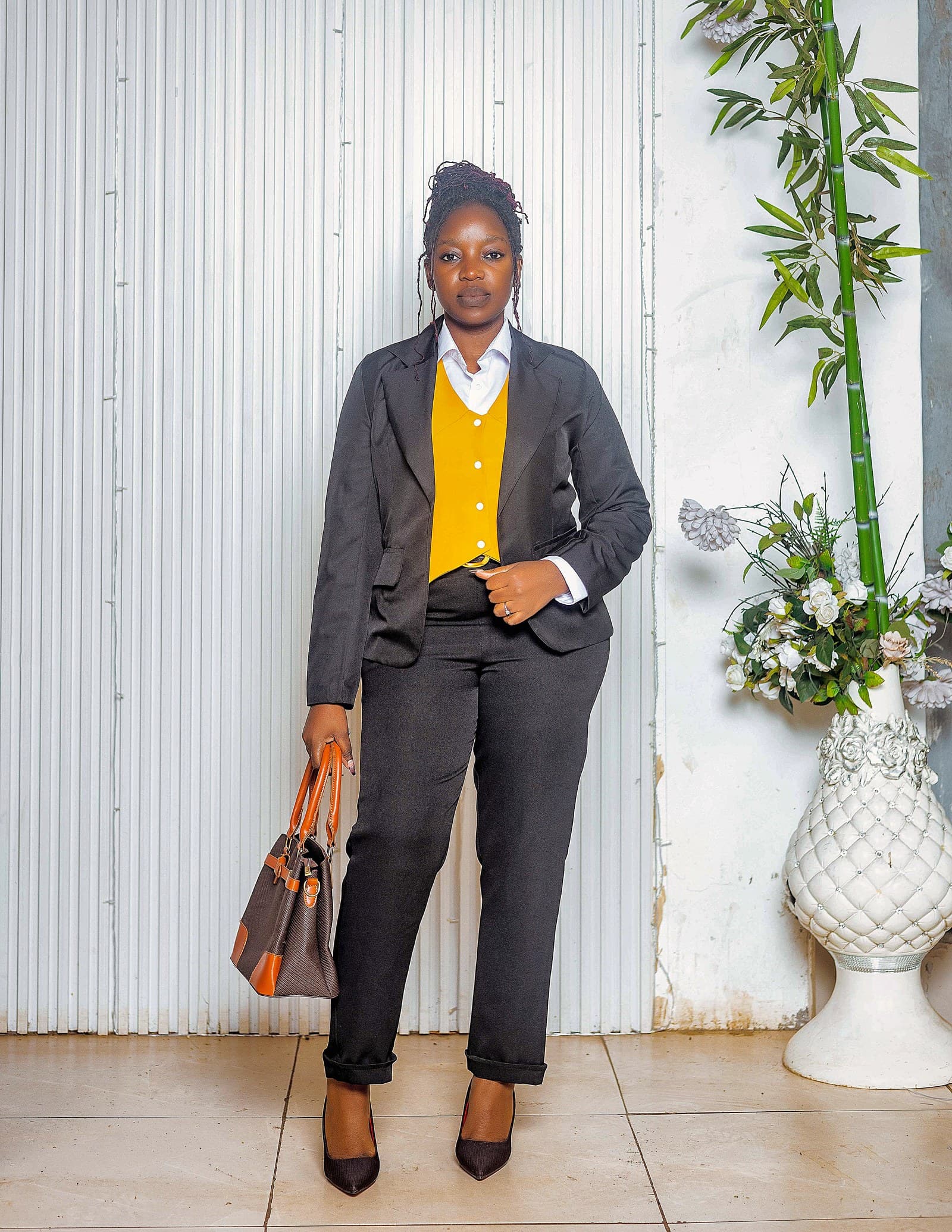 Black blazer, mustard waistcoat and black trousers