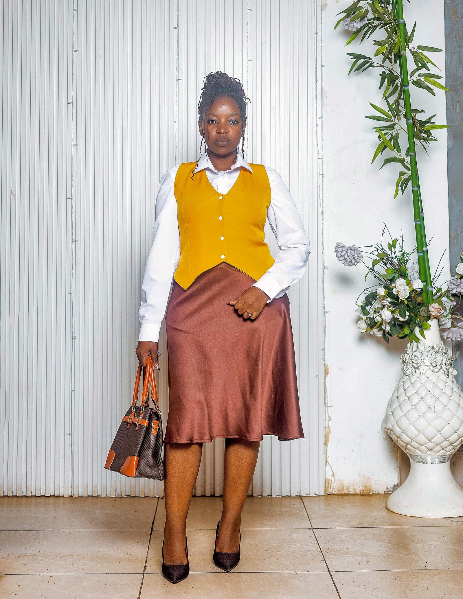 Mustard waistcoat over white shirt with bronze satin skirt