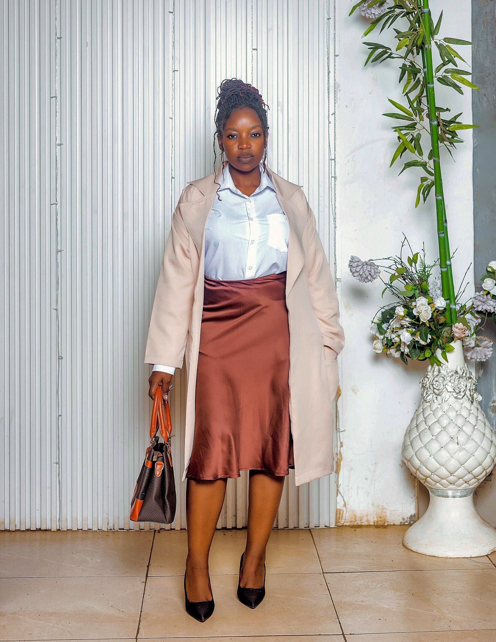 Cream coat, white shirt and bronze satin skirt