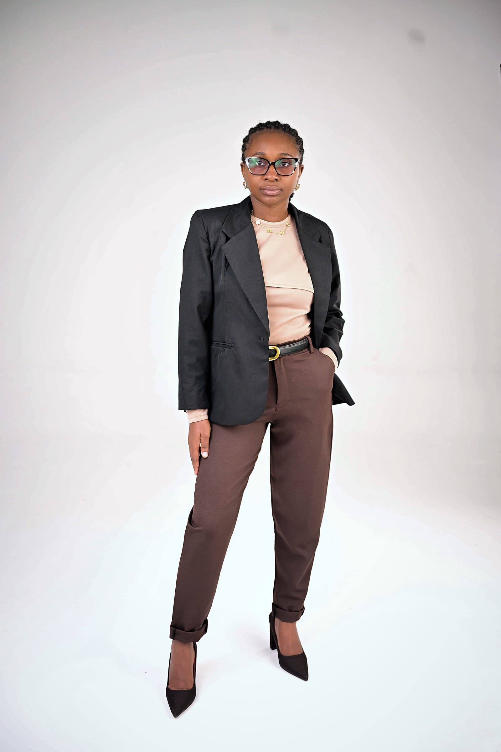 Black blazer, blush top and chocolate trousers