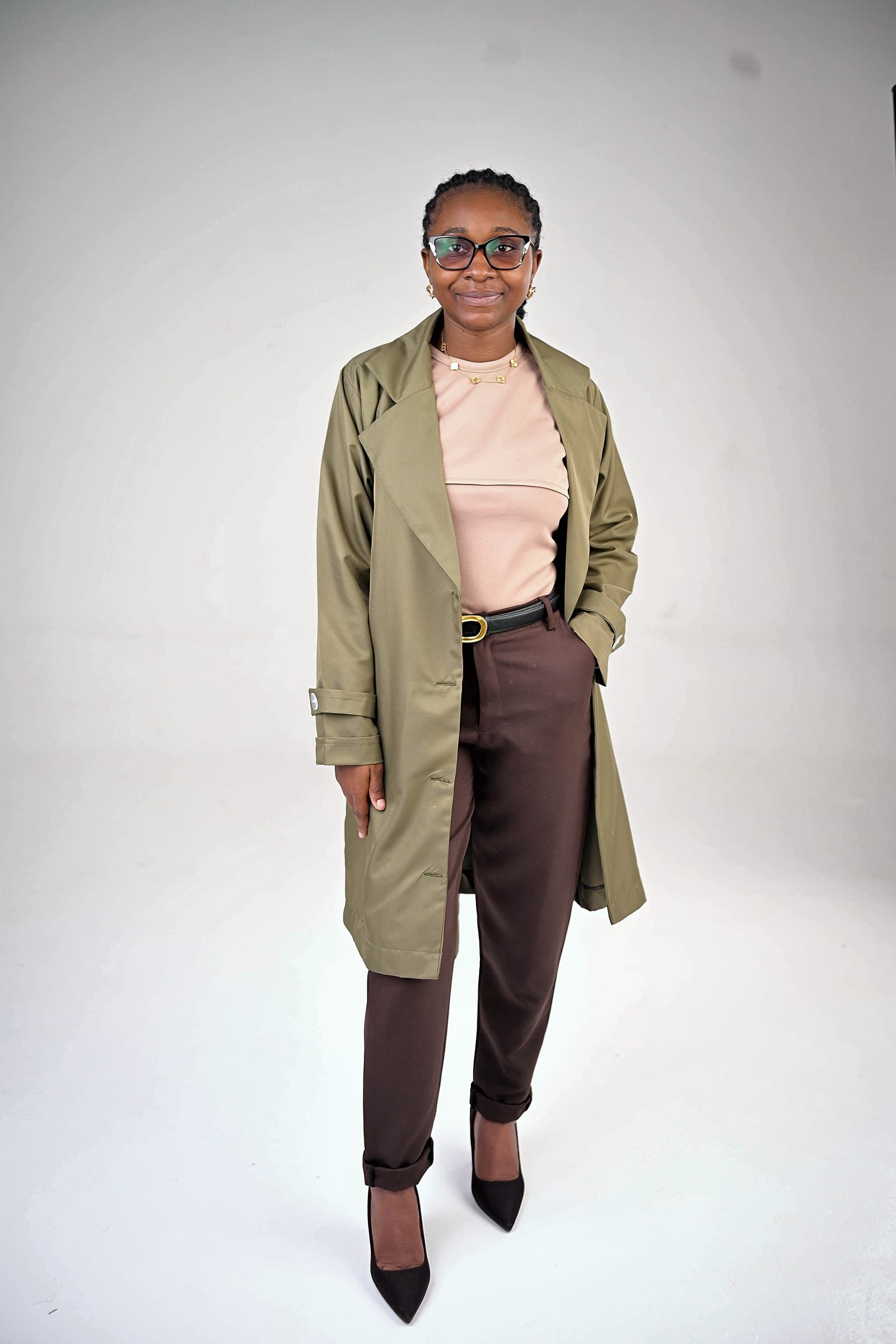 Olive trench over blush top and chocolate trousers